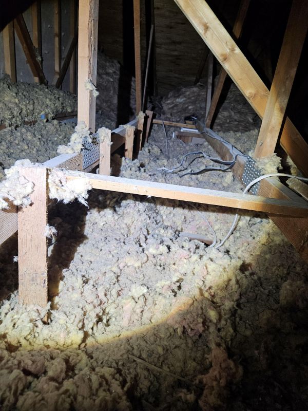 Contaminated attic blown in insulation